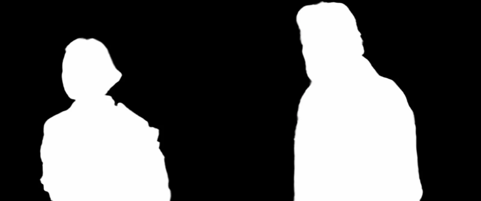 The extracted alpha matte showing two white human silhouettes against black.